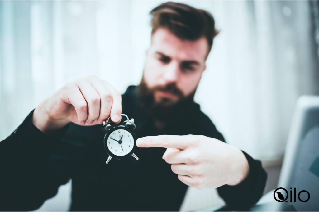 someone pointing to a clock like they have a schedule to keep